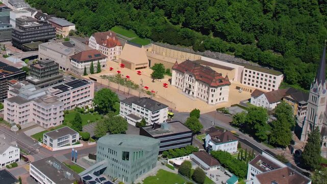 Aerial panoramic view above the downtown around the capitol city Vaduz in Liechtenstein on a sunny summer afternoon. 
