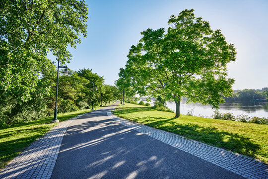 The paved pedestrian path running through Corning Preserve (aka Jennings Landing) along the Hudson River waterfront in Albany, New York