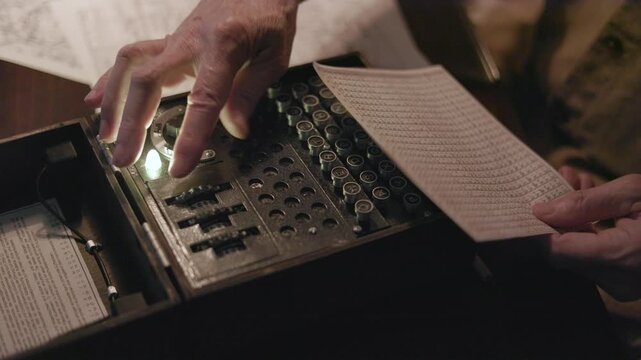 WWII German soldier sending a coded message via an enigma machine