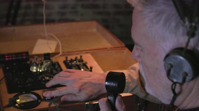 WWII spy using a suitcase transmitter to send a message