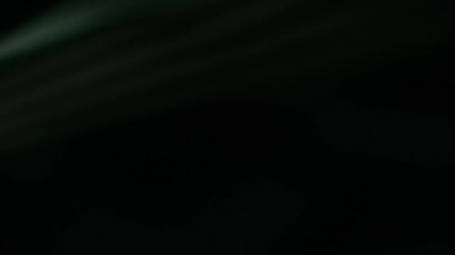 Dark Scene Moving Light Beams Across Night Setting