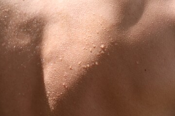 Fototapeta premium Man with sweat on his body, closeup