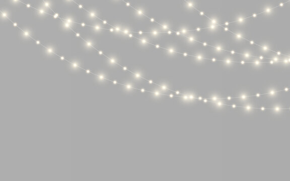 PNG. Christmas glowing string lights isolated on transparent background. Realistic LED bulbs with warm golden shine and sparkle effects. Festive vector decoration for holiday designs.

