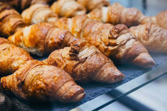 Fresh croissants on sale at a bakery or a cafe.