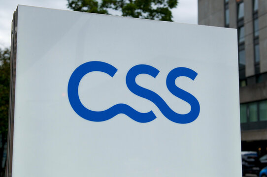 CSS insurance company blue logo on a white outdoor sign in Bern, Switzerland