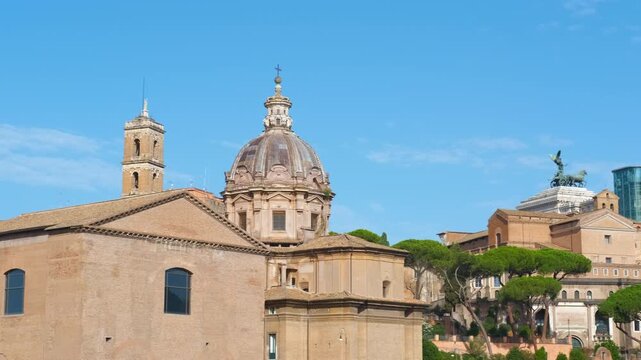 Imperial fora roman ruins ancient monuments in rome. Historic roman ruins of the imperial fora showing the temple of saturn, the curia julia, and the church of saints luke and martina against a sky