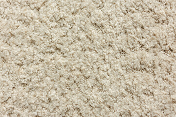 Soft beige carpet texture full frame background © Iryna Miadzvedzeva