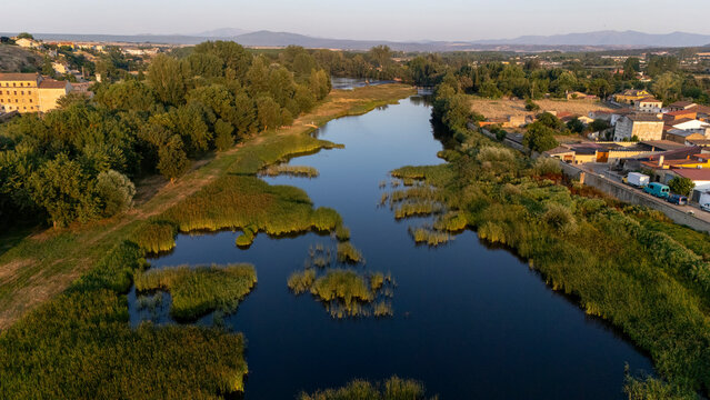 Aerial drone view of the &Aacute;gueda River as it flows through Ciudad Rodrigo, Salamanca, Spain.