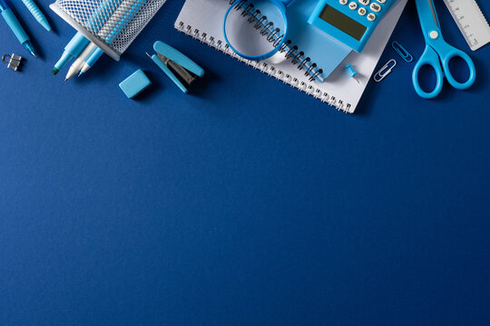 Blue school supply flat lay for back to school study and office organization