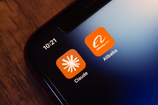 Mexico City, MEXICO - Jul 7 2026 : Close-up of an iPhone home screen showing the Claude app icon by Anthropic next to the Alibaba icon.