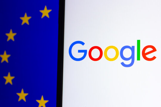 Mexico City, MEXICO - Jul 7 2026 : Close-up of the Google logo shown on a screen next to the flag of the European Union.