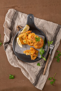 Crispy Golden Cod Fish Fritters Served with Fresh Lemon and Parsley
