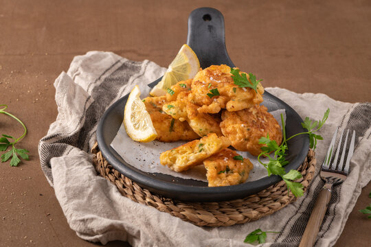 Golden Fried Cod Fish Fritters Served in a Rustic Skillet