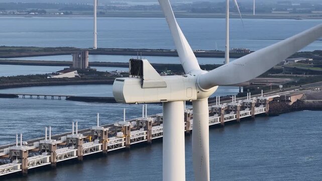 Wind turbine blades spinning generating sustainable energy at oosterscheldekering