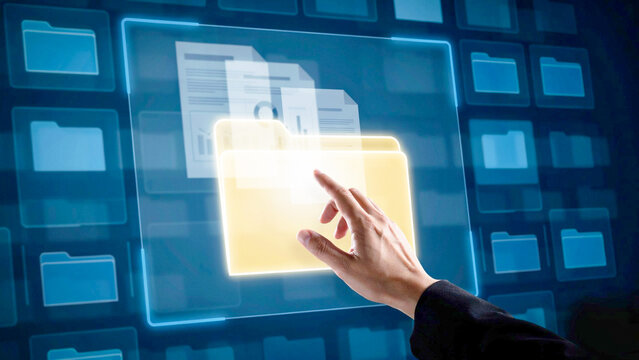 Person interacting with virtual files on a futuristic digital interface screen
