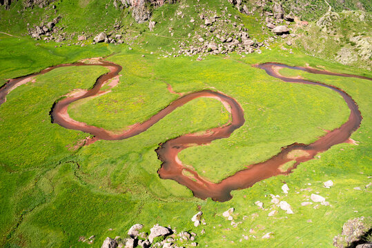 Aerial view of a river meandering through the Aguas Tuertas, Western Valleys Natural Park, Huesca, Aragonese Pyrenees, Spain
