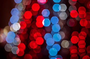 Abstract colorful bokeh lights background with red blue and white circles © Danylo Ponomarov
