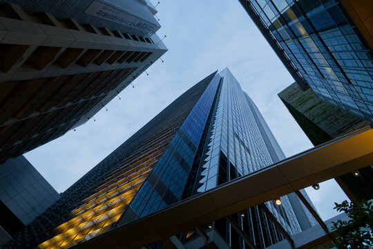 Tokyo Dramatic Wide Angle View of Modern Skyscraper Rising Above Marunouchi Business District Tokyo Station, Contemporary Urban Architecture in Japan