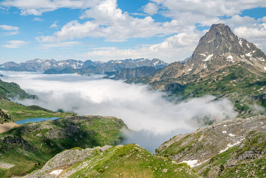 Pic du Midi d'Ossau, Lac Roumassot lake and the Ossau on a foggy day, French Pyrenees National Park, France