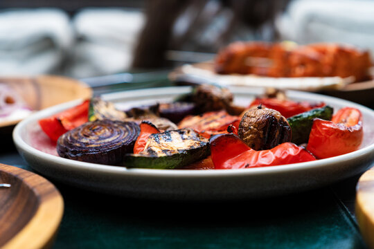 Close-up side view of a plate of assorted grilled vegetables