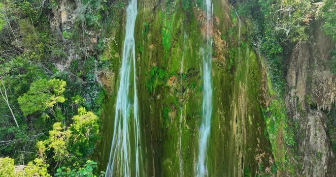 Landscape of waterfall cascade in the heart of mountan tropical rainforest Dominican republic, el limon, samana island