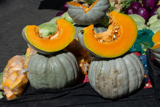 Close-up of fresh pumpkins and pumpkin slices for sale in a market, Turkey