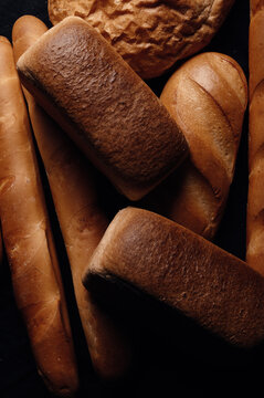 Overhead view of a stack of assorted loaves of bread