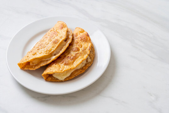 Dobladas - Guatemalan Folded Fried Tortillas with Cheese and Salsa - With Copy Space