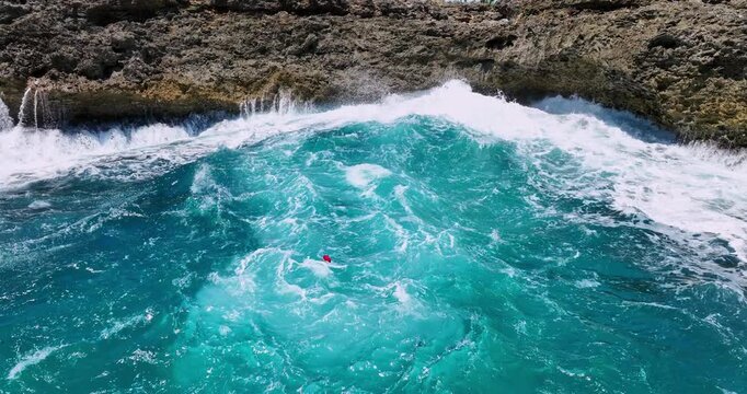 rocky coastline with sea caves and waves crashing on the cliffs Boca de Yuma, Dominican republic