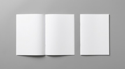 Fototapeta premium Open and closed blank brochures on grey background, top view. Mock up for design