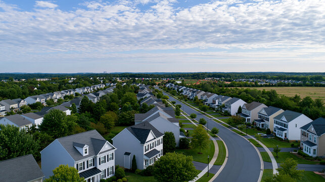 Aerial view of a typical American new construction neighborhood street in Maryland for upper middle class, dramatic sky concept, with copy space
