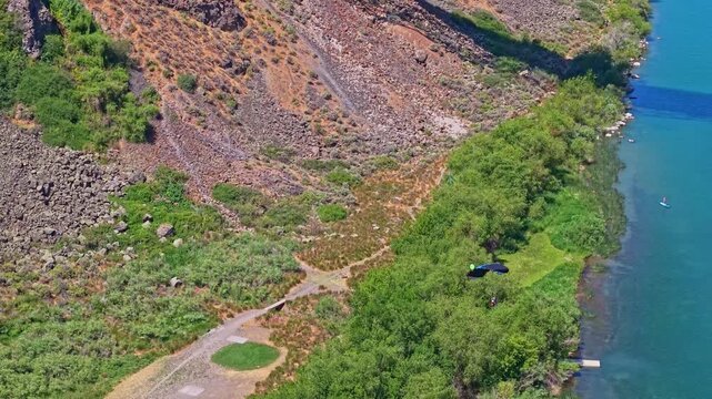Daring base jumper leaps off the iconic Perrine Memorial Bridge over the Snake River canyon in Twin Falls Idaho