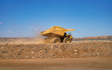 Kalgoorlie gold mining Western Australia a large yellow mining dump truck with blue sky © electra kay-smith