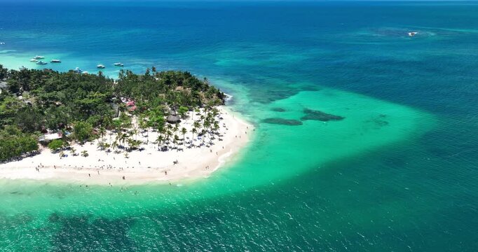 Tropical island beach shore  with palm trees and Caribbean Sea aerial nature landscape of exotic island Cayo Levantado, Dominican Republic
