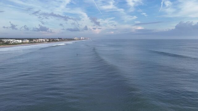 Stand up paddleboarding on a beautiful morning at Ormond Beach in Volusia County, Florida. 