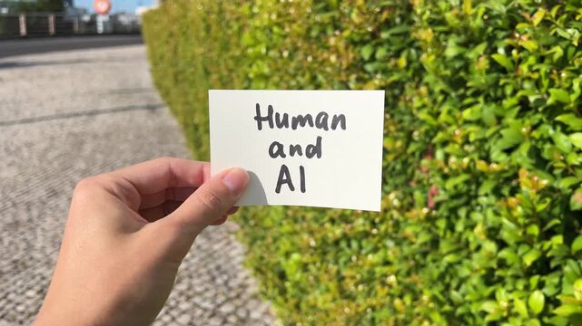 Human and AI - text in hand, future with artificial intelligence concept