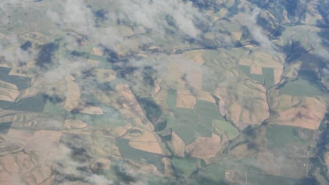 Aerial view of agricultural fields and clouds in Washington state