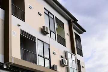 modern apartment building exterior with balcony and window under daylight © sutichak