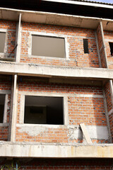 Obraz premium exterior view of brick house under construction with concrete structure