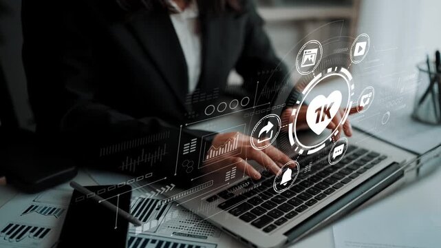 Business person using laptop to analyze data with digital interface displaying social media metrics and performance statistics in modern office environment. Entropy.