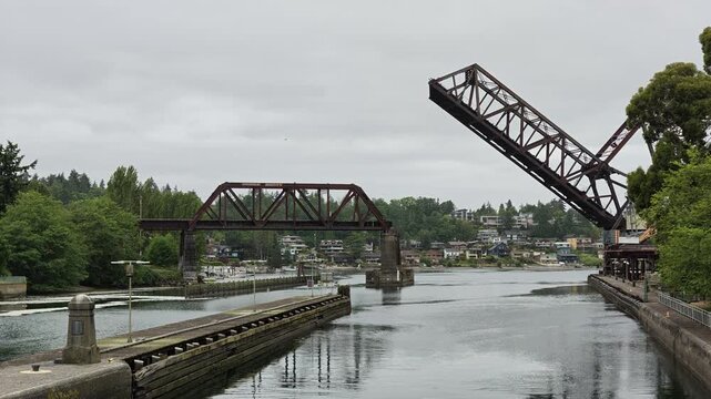 Salmon Bay Bridge drawbridge raised over canal with lock