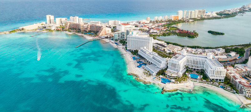 Aerial panoramic view of Cancun beach and city hotel zone in Mexico. Caribbean coast landscape of Mexican resort with beach Playa Caracol and Kukulcan road. Riviera Maya in Quintana roo region on
