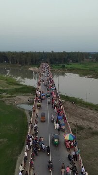 Busy bridge traffic congestion aerial view bustling city life commuters motorbikes rickshaws