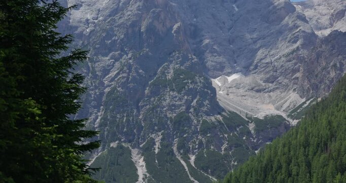 Croda Del Becco Mountain Towering Over Lago Di Braies In Dolomites, Italy. - wide shot