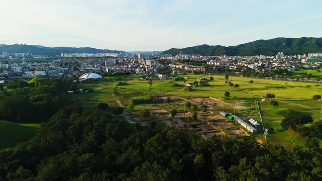 Aerial view of Daereungwon ancient tomb complex and Gyeongju cityscape South Korea