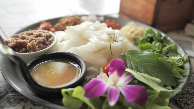 lose up of Yum Sen Yai, traditional Thai spicy flat rice noodle salad with fresh herbs, garlic, ginger, and chili. Authentic premium Thai cuisine and culinary lifestyle stock video.