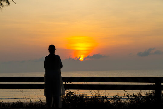 Sunrise and traveler with silhouette