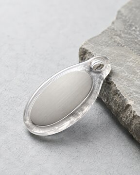 Sleek Key Fob On Textured Stone professional still life with soft light refined texture and clean minimalist composition for premium design background