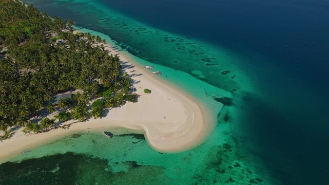 High altitude aerial rocket ascent looking straight down over Tangkahan Island, Balabac, Philippines. Top-down vertical drone flight climbs above tropical hook sandbar and reef.