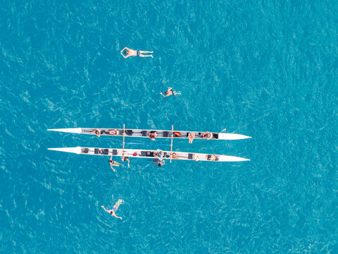 Aerial top view of an outrigger canoe in turquoise water, Fernando de Noronha, Pernambuco, Brazil